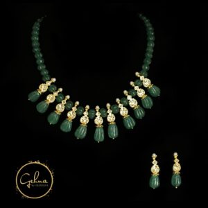 Emerald green pendant set with kundan and carved green jade drops