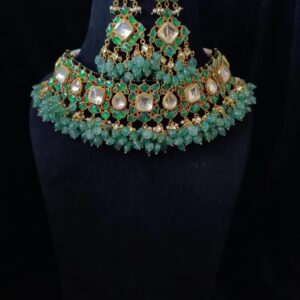 Handmade jadau necklace set with Kundan stone set in golden and green foil and with green quartz drops