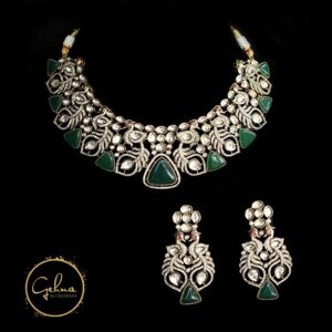 Antique finish necklace set with emerald green and AD stones