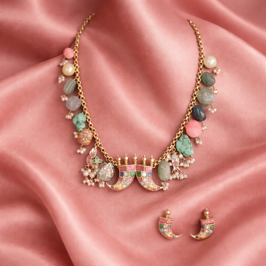 Elegant gemstone necklace on soft pink fabric