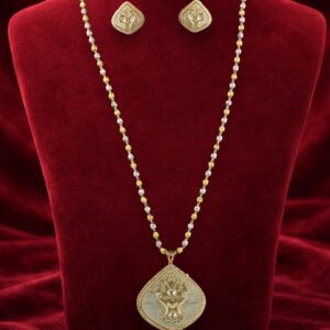 Kundan and mother of pearl long pendant set with matching earrings