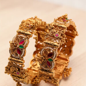 Antique gold designer bangle with red and green stones