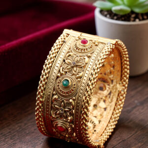 Golden kada with red and green stones